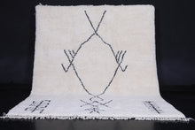 Handmade Moroccan Beni Ourain Rug – White Wool with Black Geometric Symbols
