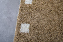 Custom light brown Moroccan rug with white checkered design